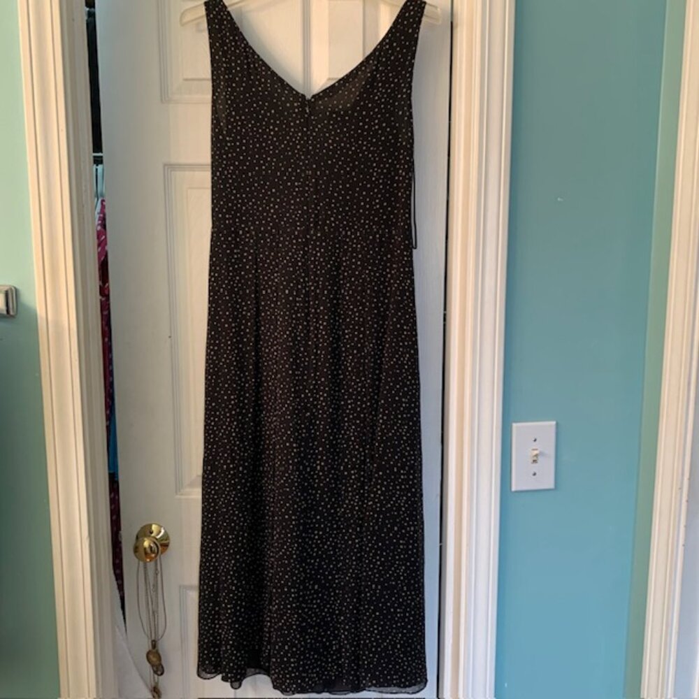 Silky black flowing dress with beige dots and black lining